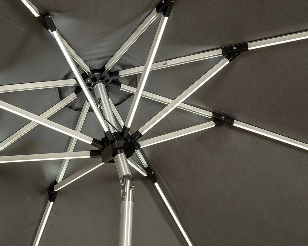 Under-view of grey crank-tilt parasol with solar LED lights along ribs