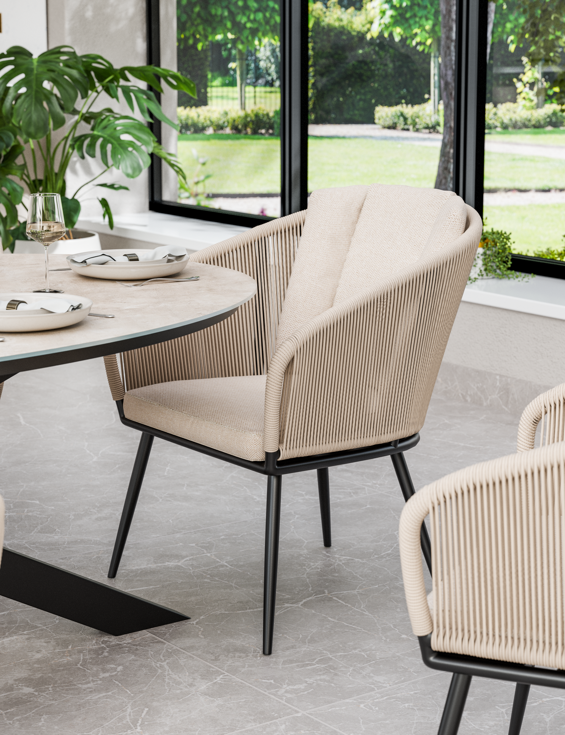 Outdoor dining chair and table detail with woven frame and neutral cushion