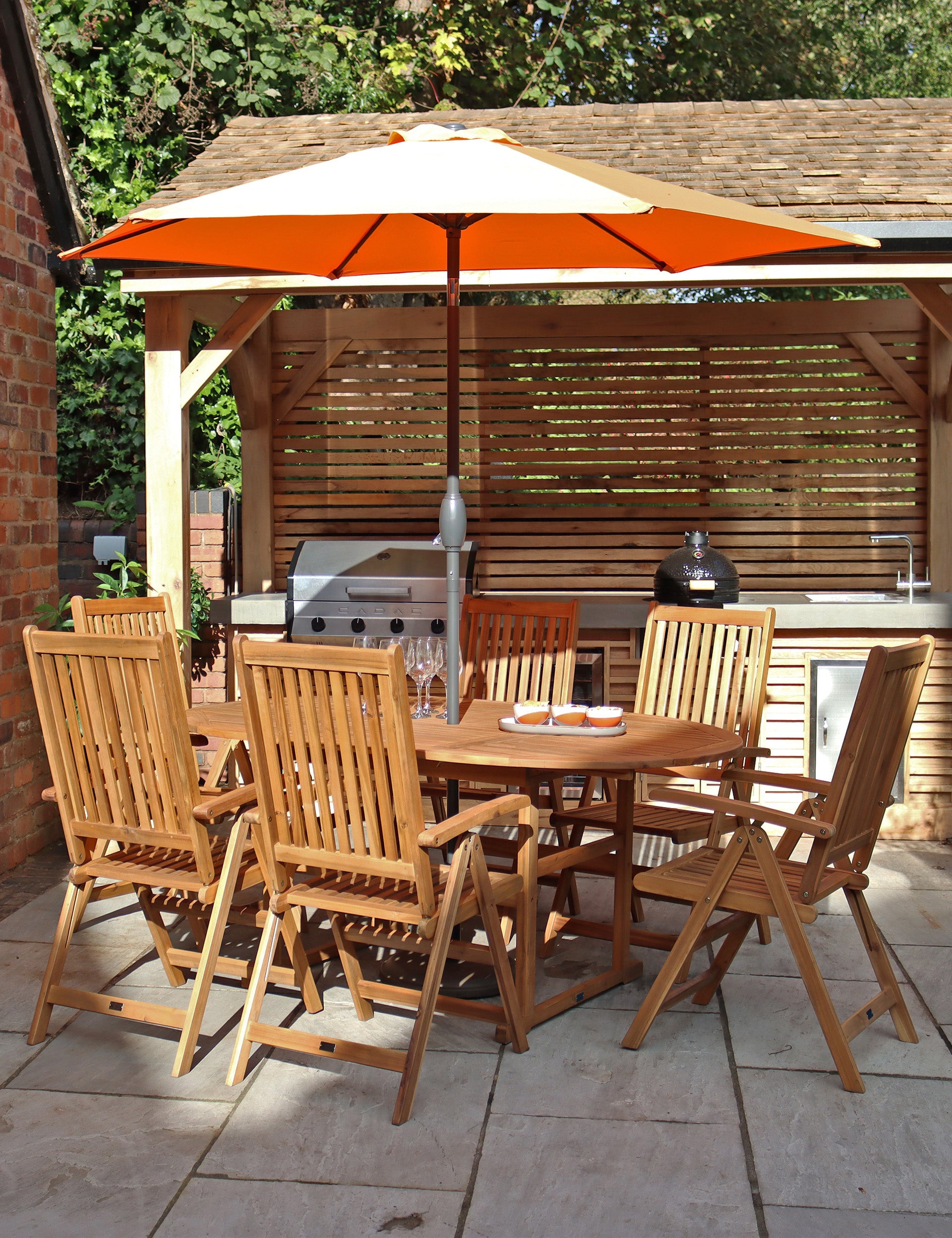 Wooden garden dining set with six chairs and central parasol