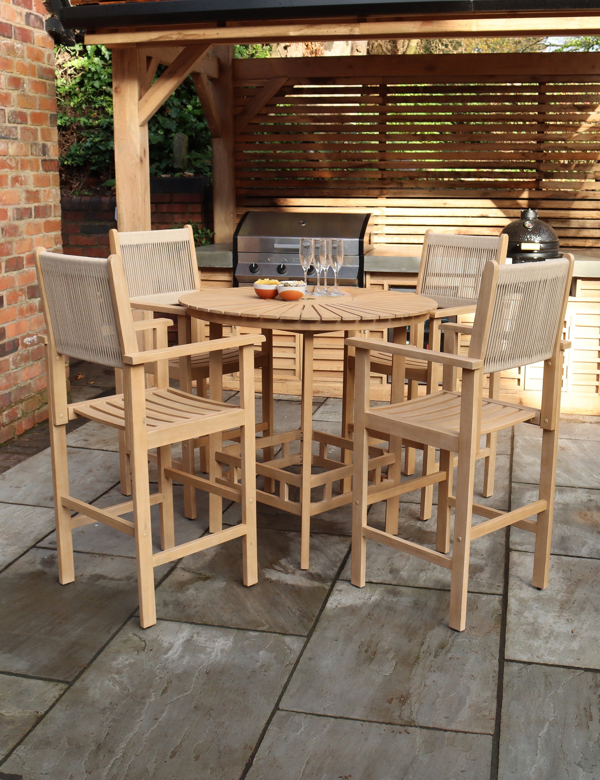 Outdoor bar table set with stools in dark wicker and wood top