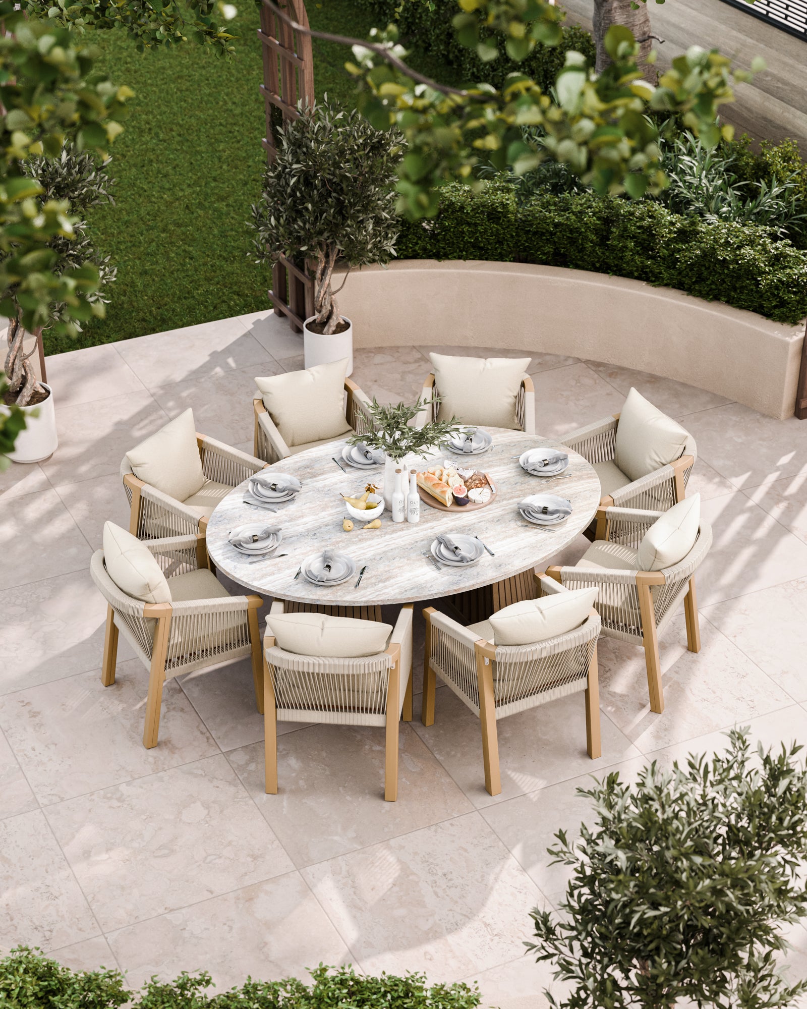Bird’s-eye view of large round outdoor dining table with 8 cushioned chairs