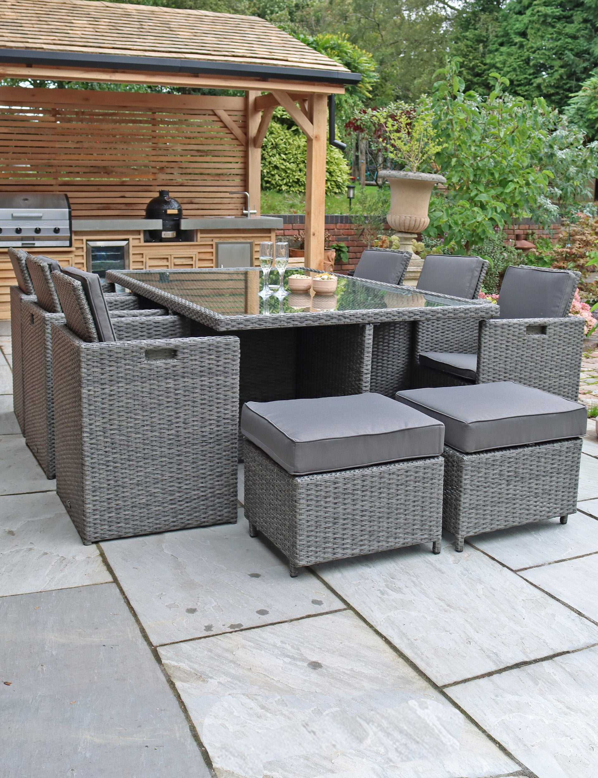 Grey rattan 10-seater cube dining set with cushioned chairs and stools