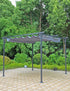 Black metal pergola with canopy set on a paved patio near greenery