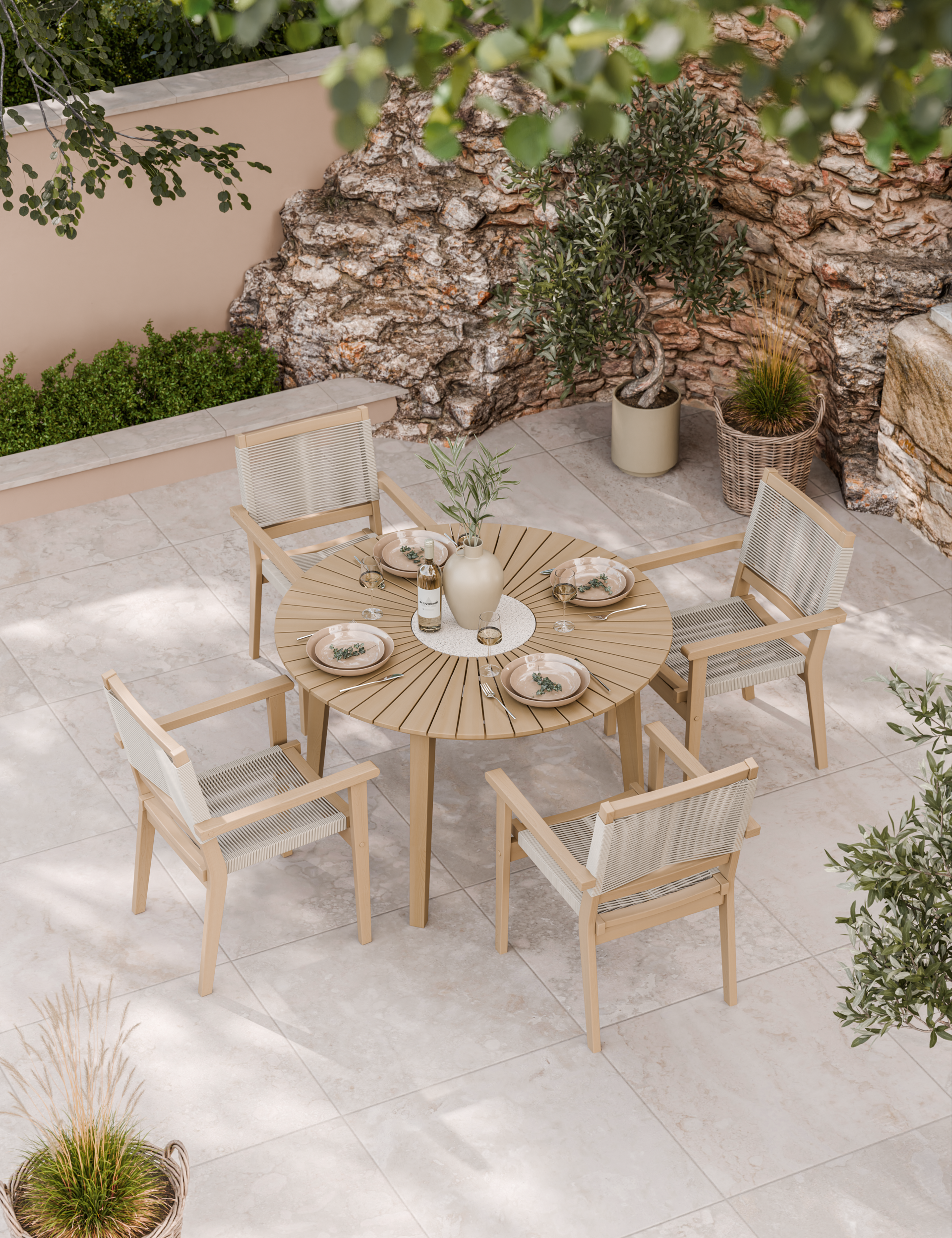 Outdoor dining set with round wooden table and four matching chairs