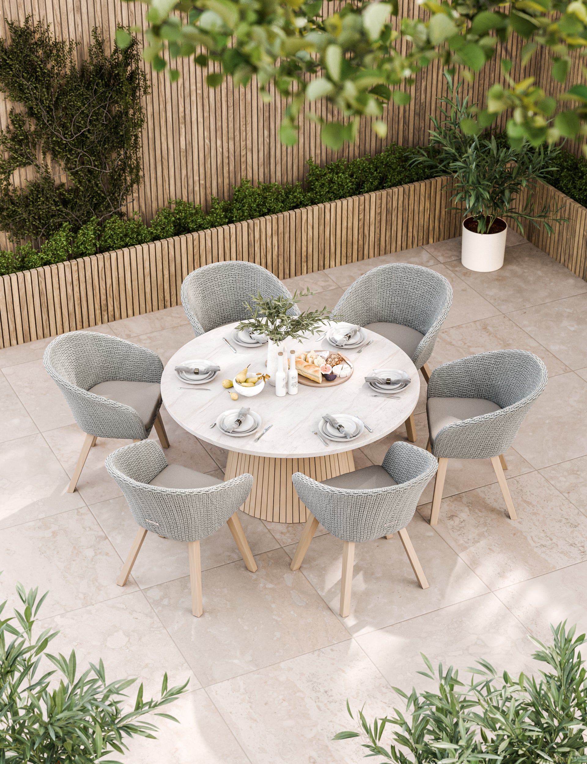 Grey outdoor dining set with round table and six chairs