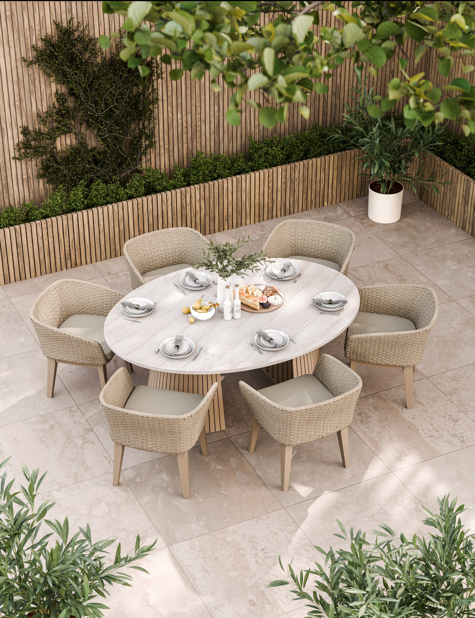 Beige outdoor dining set with oval table and six cushioned chairs