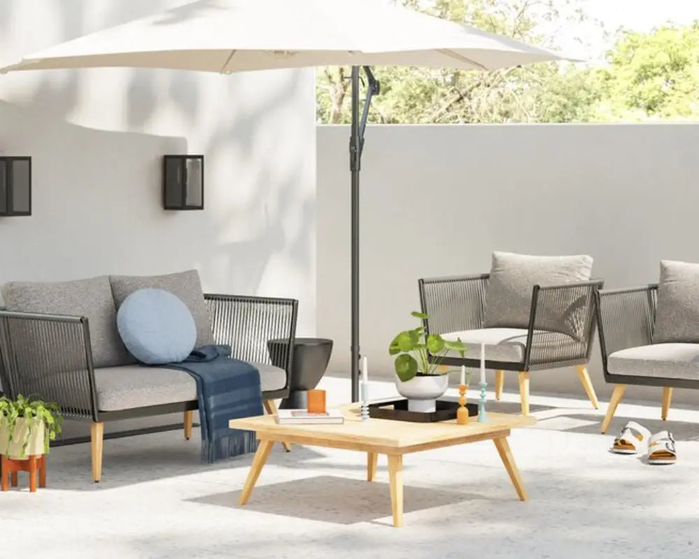 Outdoor lounge set with sofas, coffee table, and parasol
