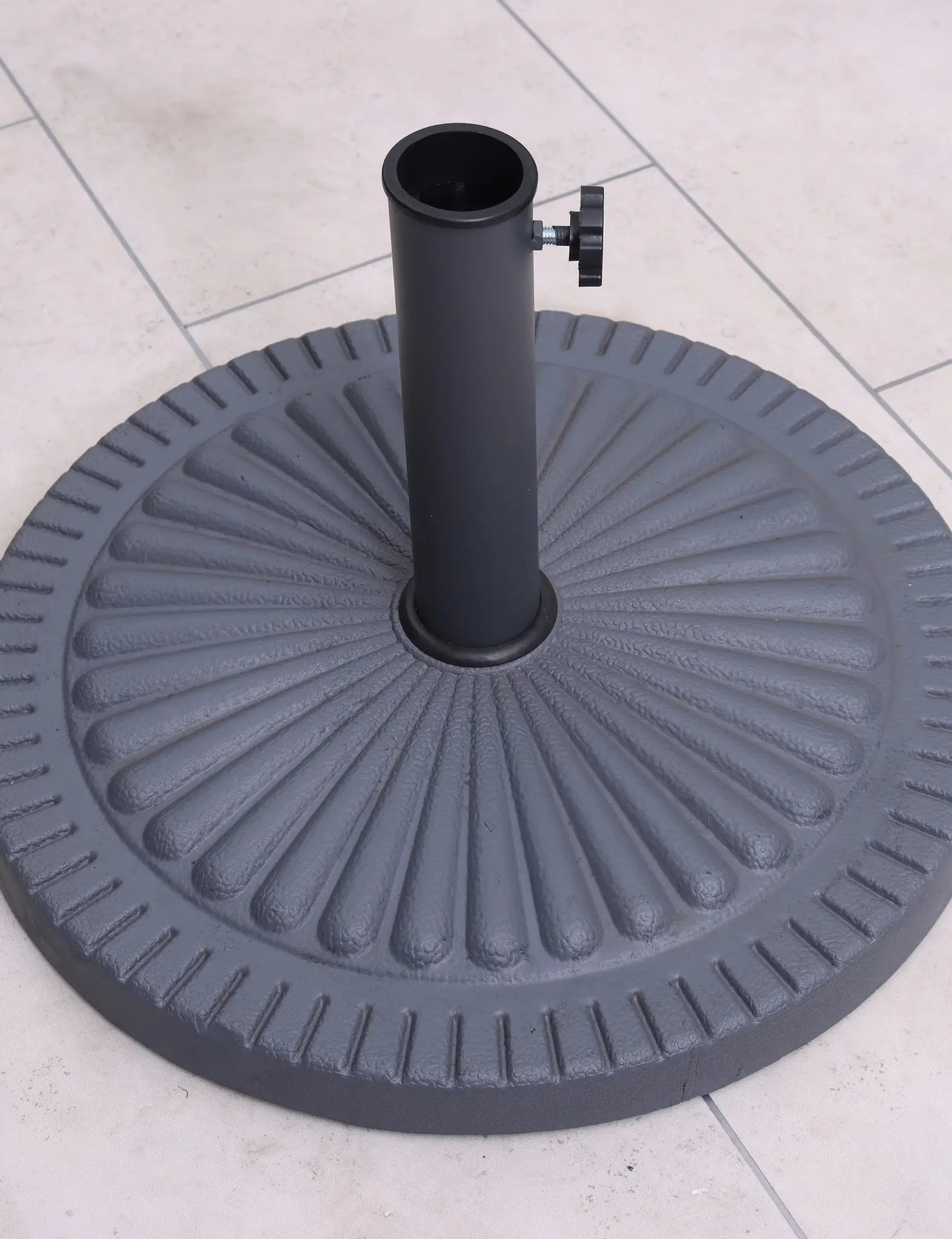 Black metal parasol base with embossed design