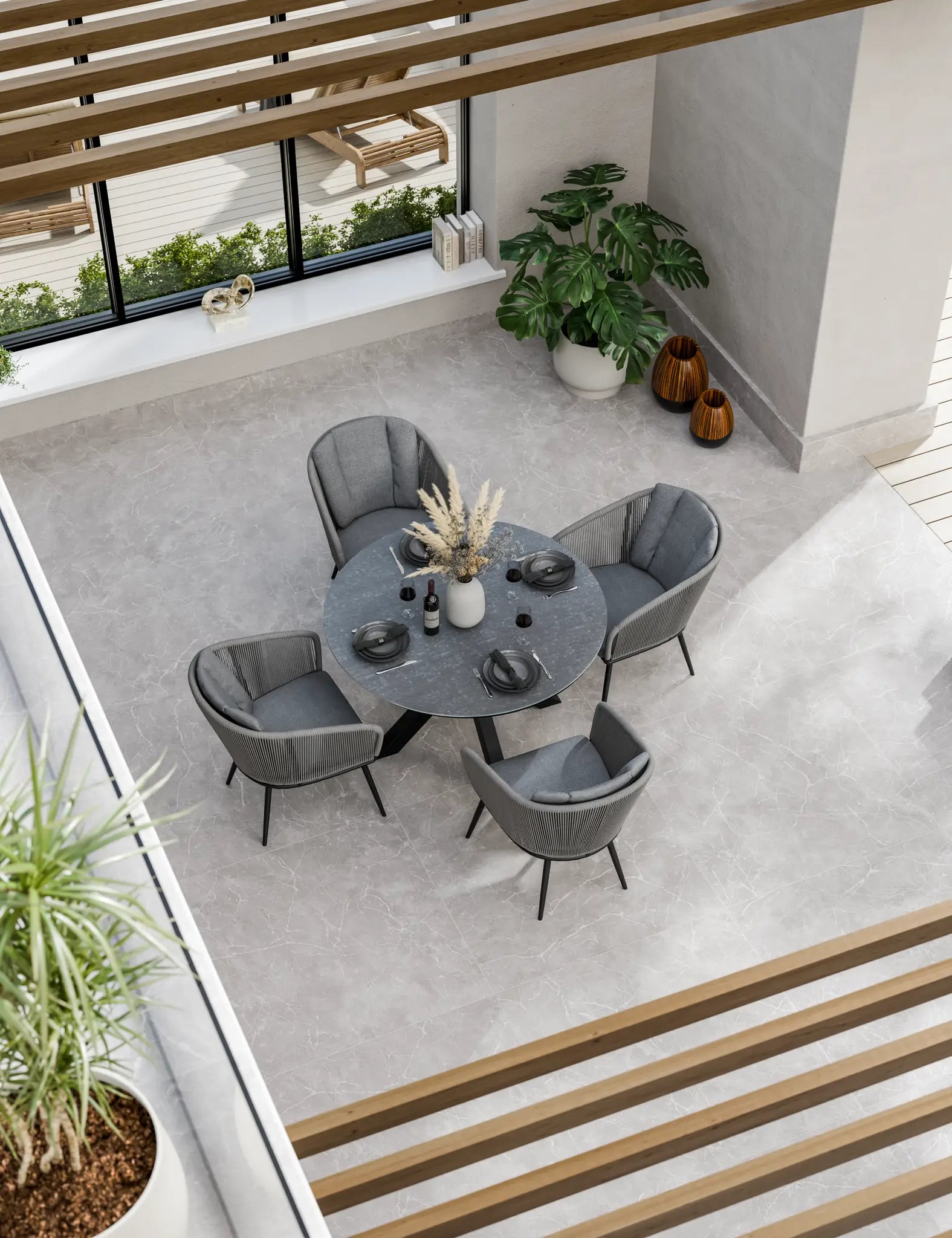 Bird‚Äö√Ñ√¥s-eye view of grey outdoor dining set with round table