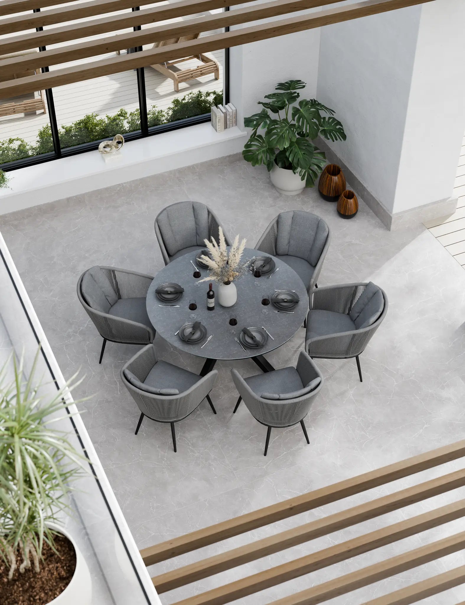 Bird‚Äö√Ñ√¥s-eye view of grey outdoor dining set with round table 6 chairs