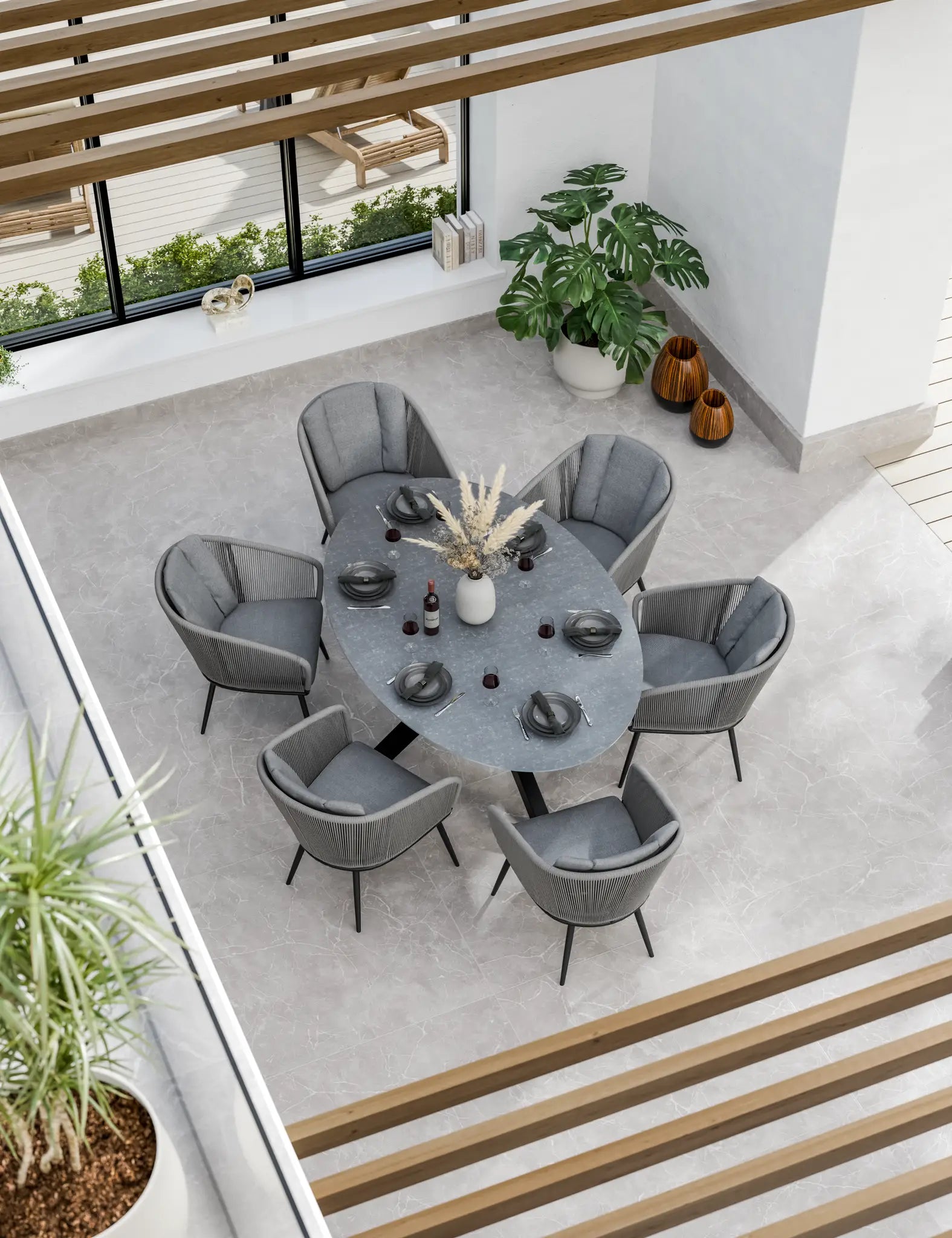 Bird‚Äö√Ñ√¥s-eye view of grey outdoor dining set 
