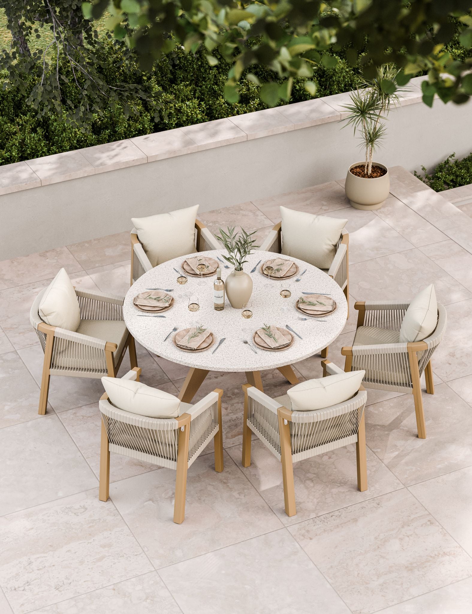 Six-seater patio dining set in neutral tones on stone paving