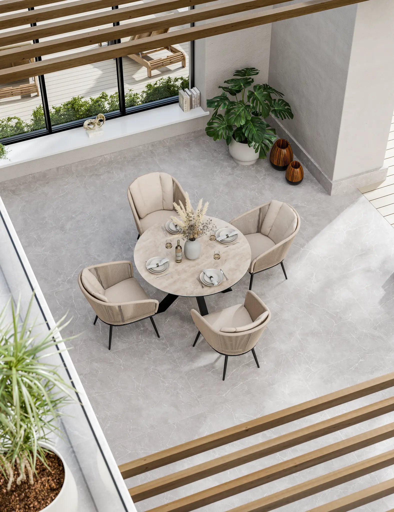 Image of Top-down view of outdoor dining set arranged on stone terrace