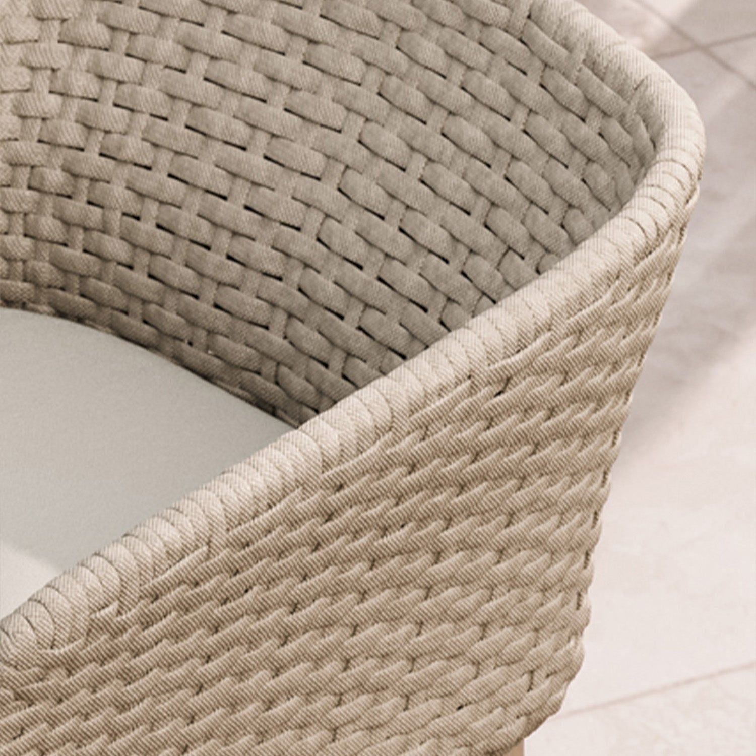 Image of Close-up of a rope weave chair with a neutral color palette