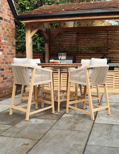Wooden outdoor bar table with six tall stools