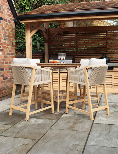Wooden outdoor bar table with six tall stools