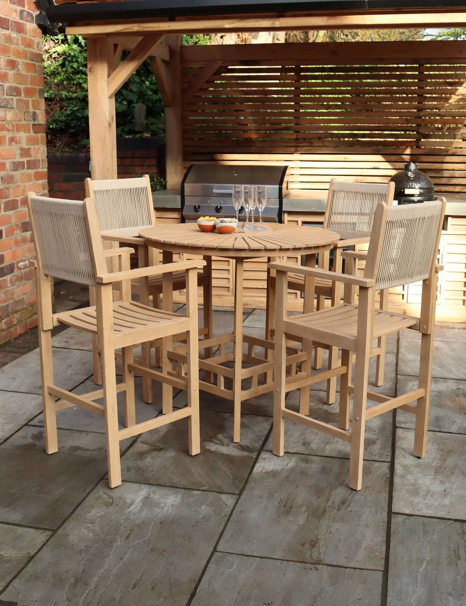 Outdoor bar table set with stools in dark wicker and wood top