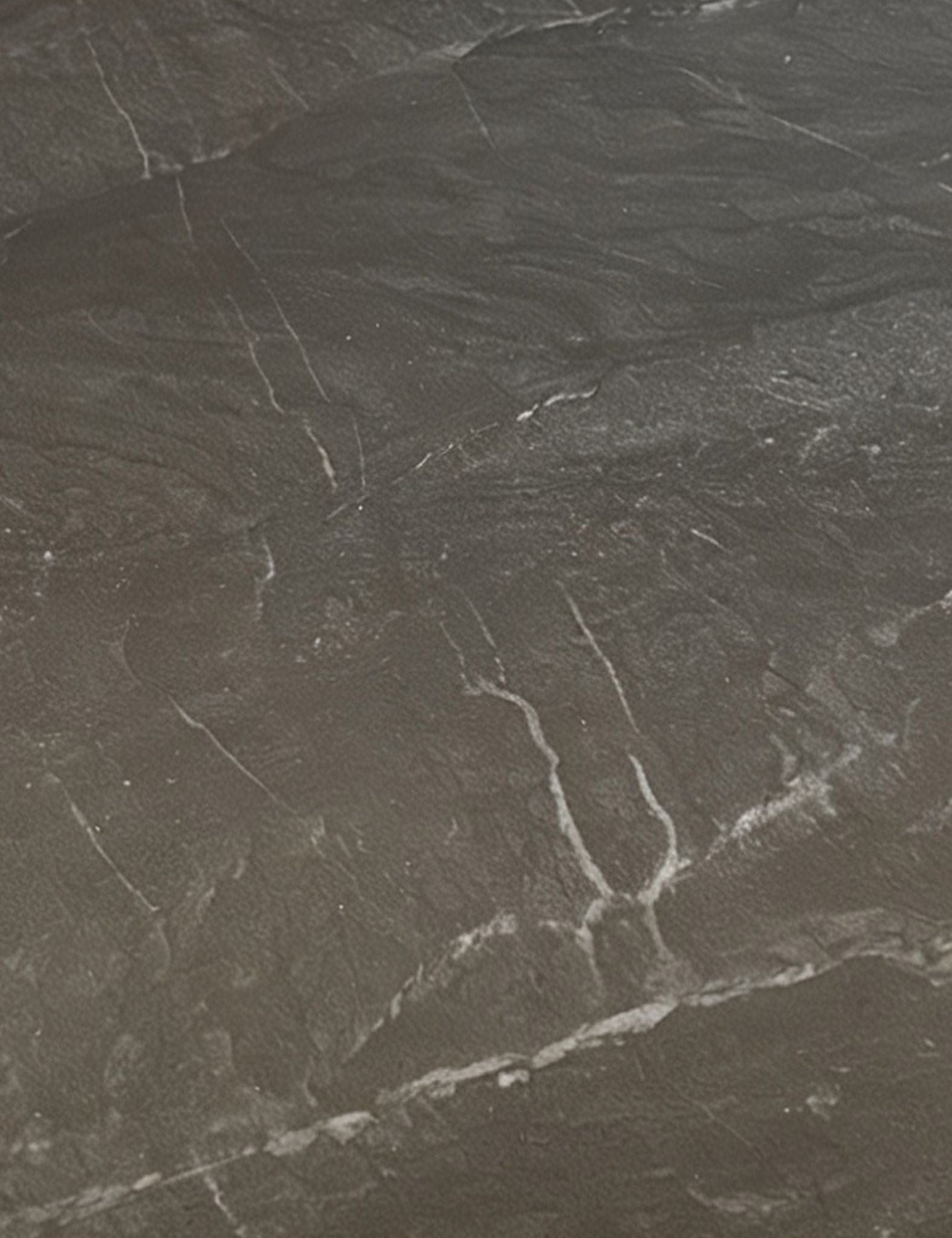 Image of Dark gray stone tile with natural white veining and a textured surface.