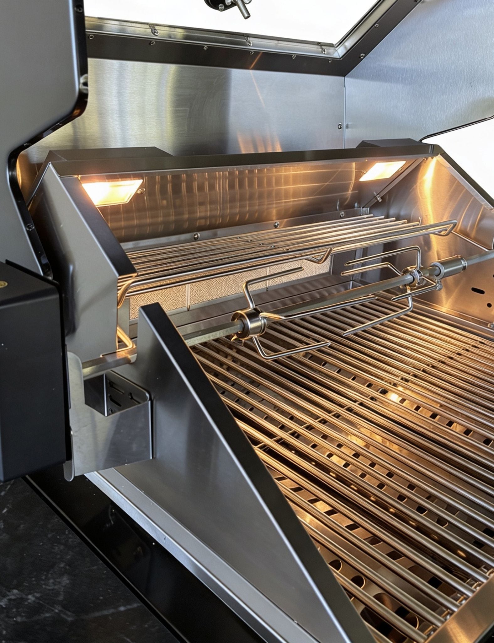 Image of Close-up of a grill with open lid showing interior grates.