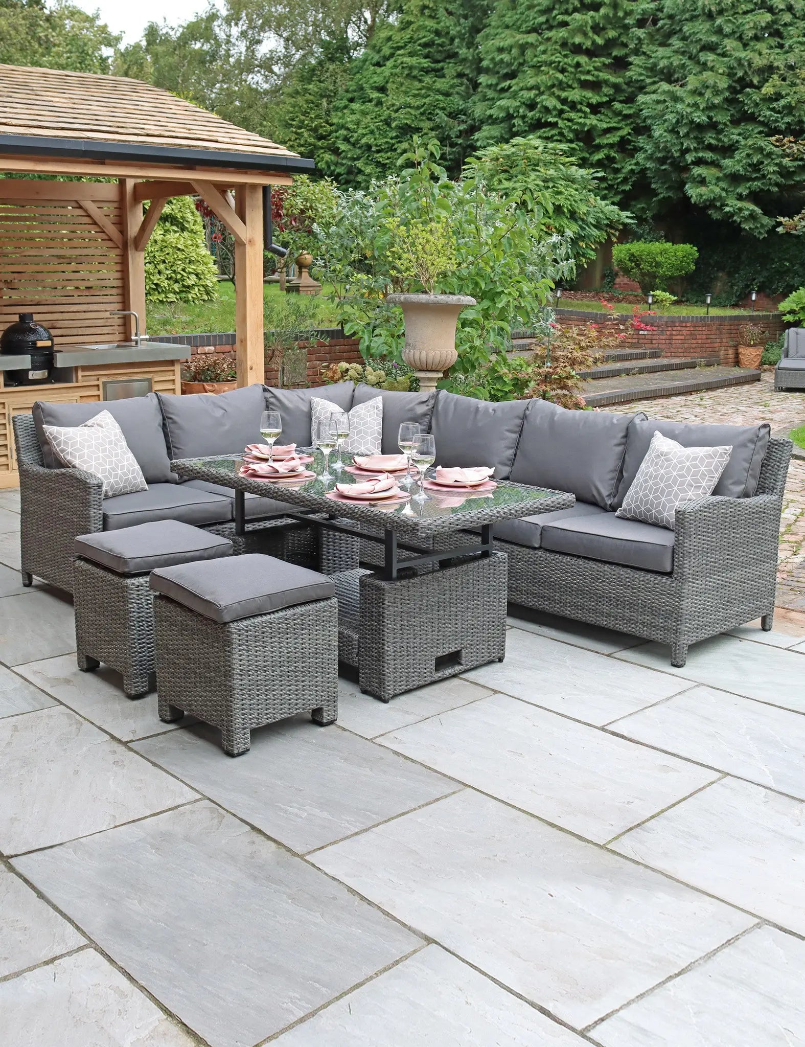 Grey rattan modular corner sofa set with stools and glass-top table