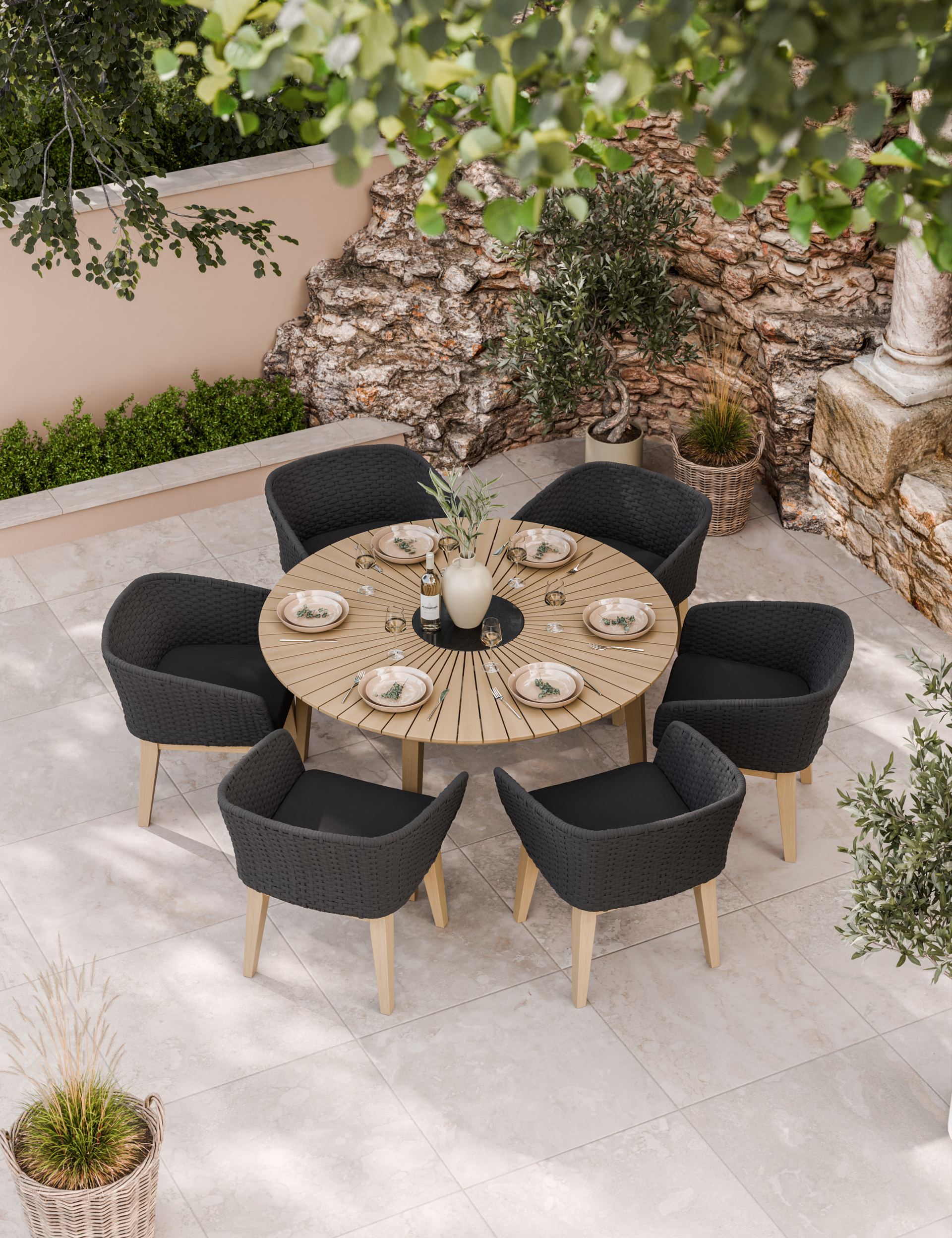 Image of Round patio table with six black cushioned chairs set for dining