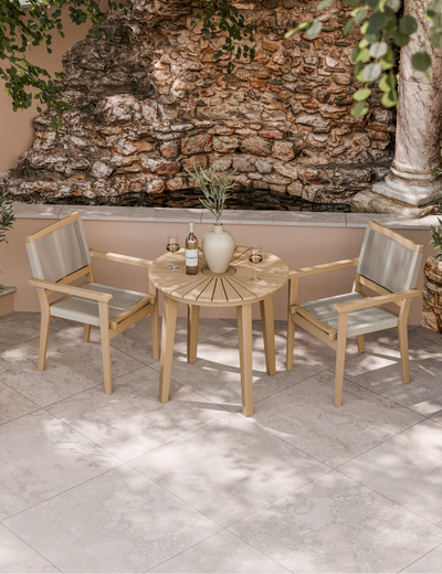 Rope bistro set with round table on garden patio