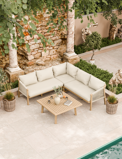 Cream corner sofa set with table by poolside patio