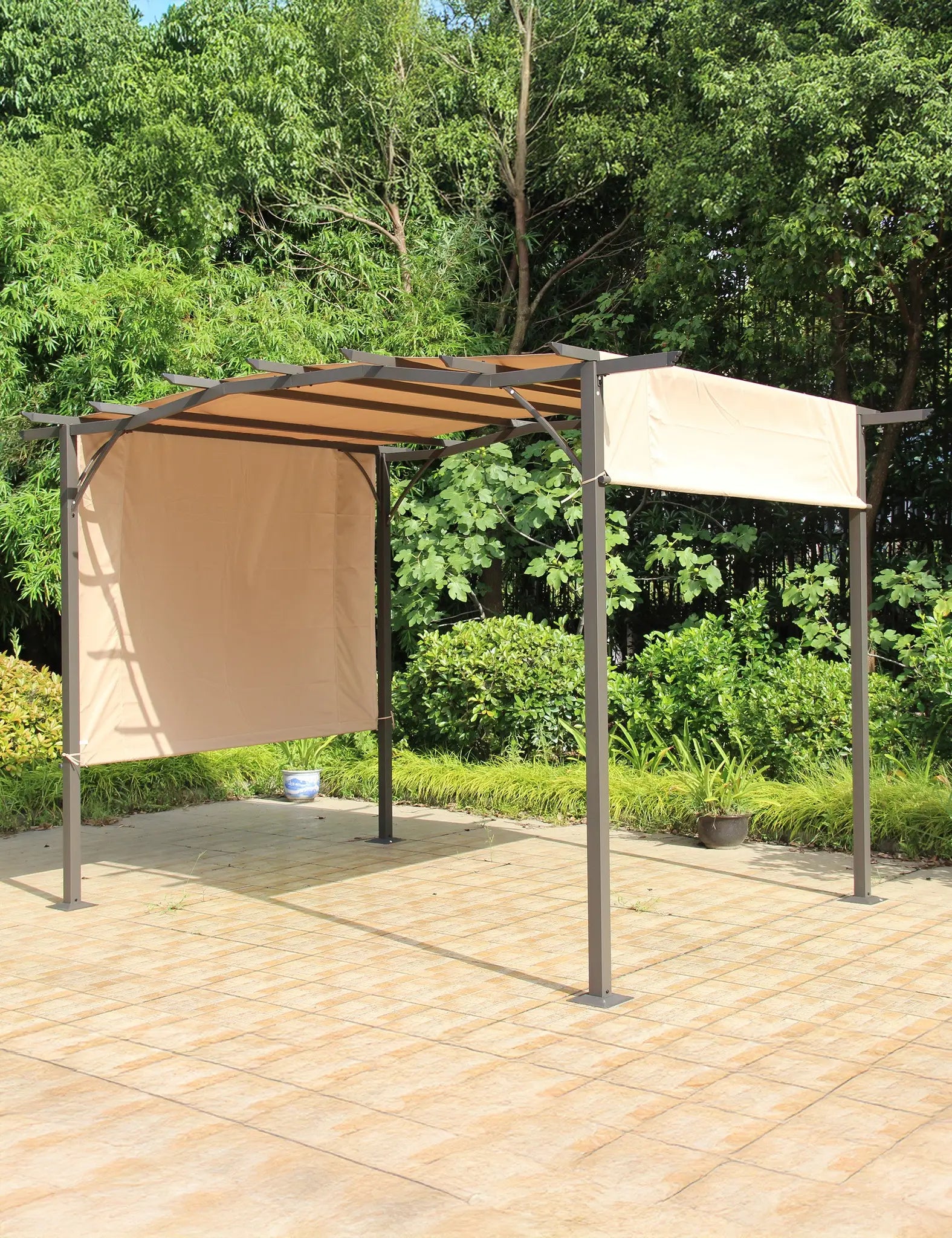 Beige pergola with retractable canopy in garden setting