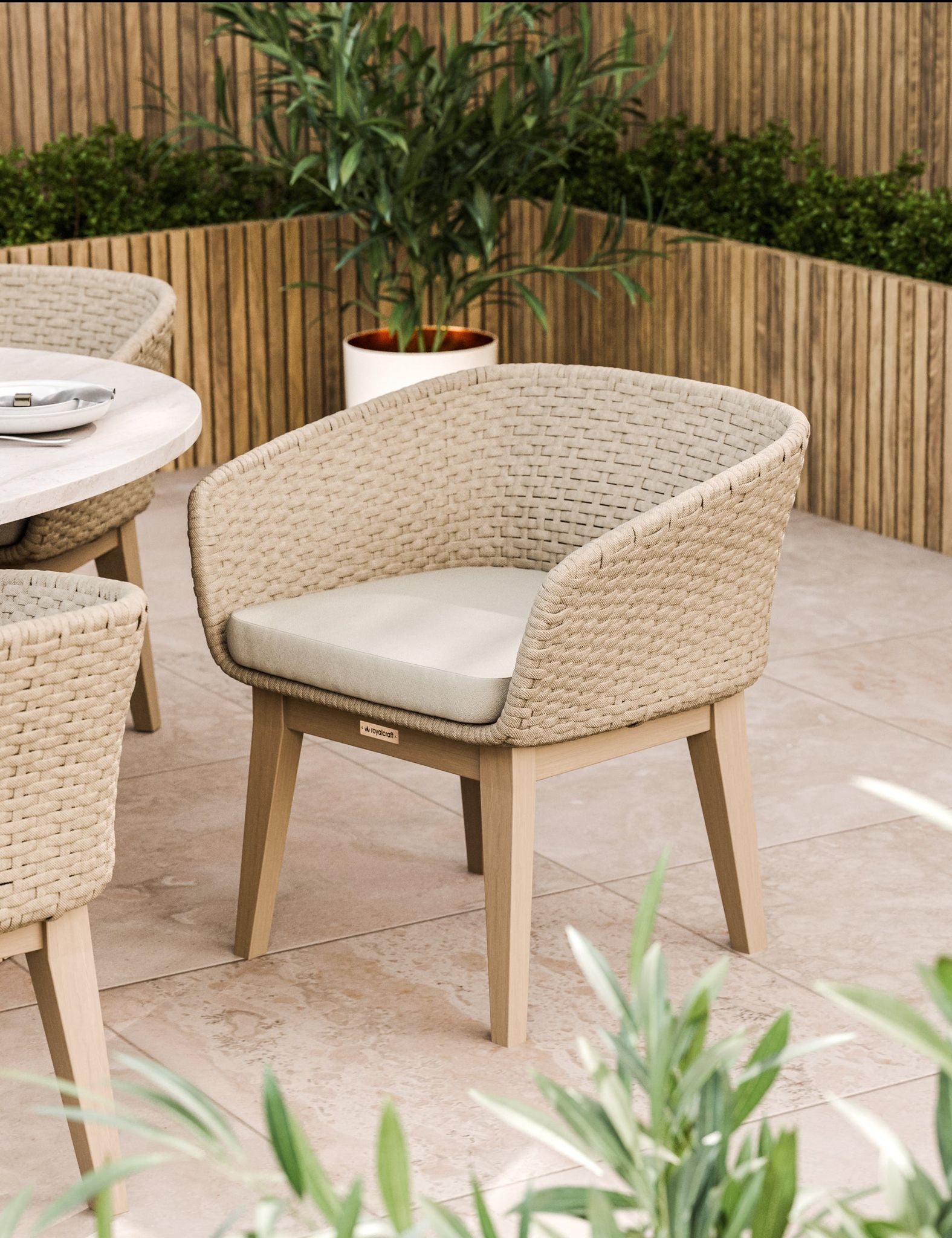 Beige cushioned outdoor dining chair with wooden legs