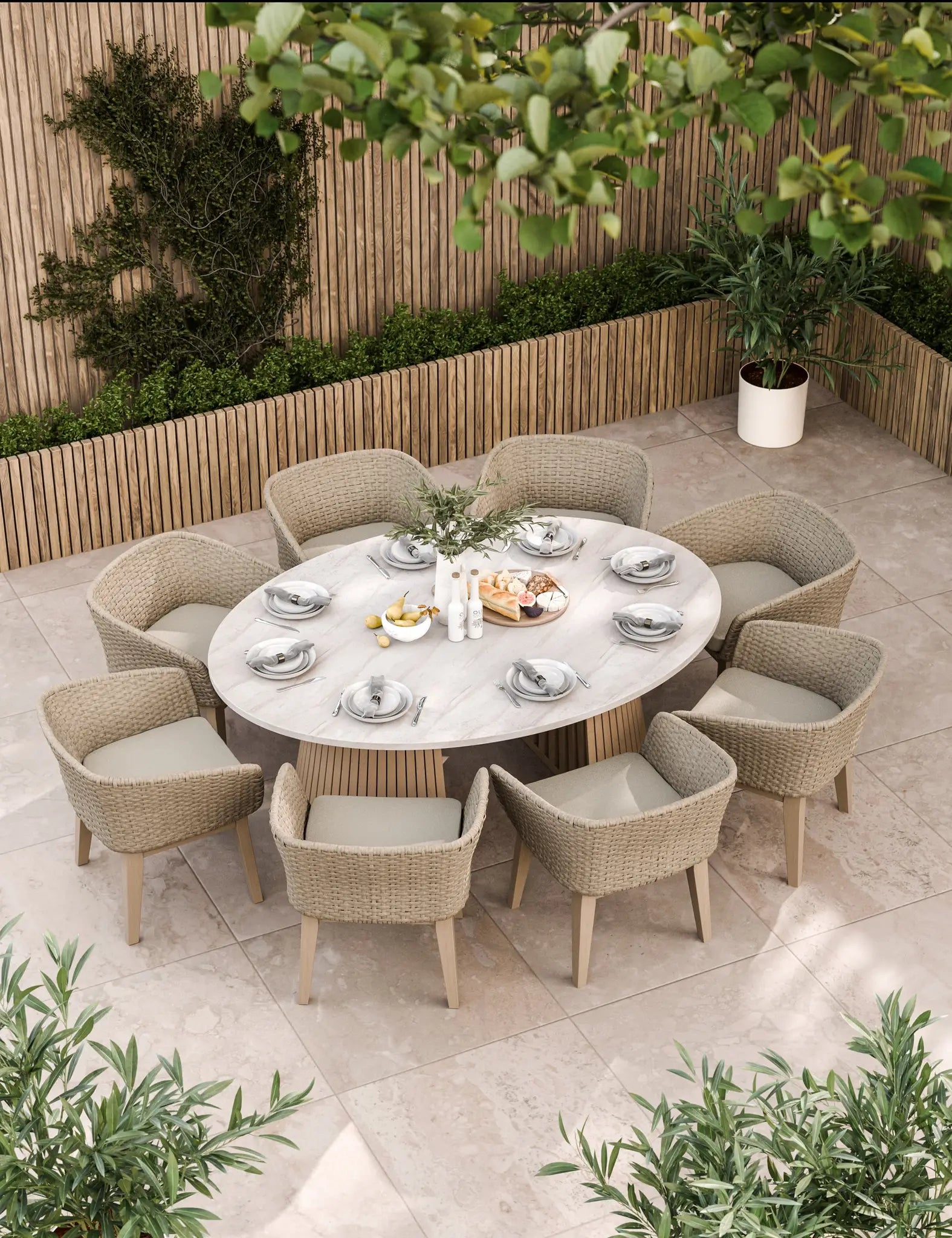 Beige outdoor dining set with oval table and eight chairs