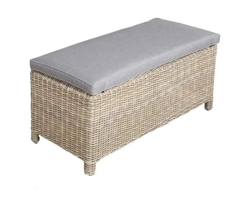 Image of Wicker bench with a gray cushion on a white background