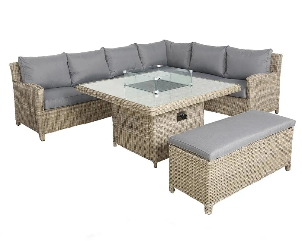 Image of Outdoor patio furniture set with a sectional sofa, glass-top table, and ottoman on a white background.