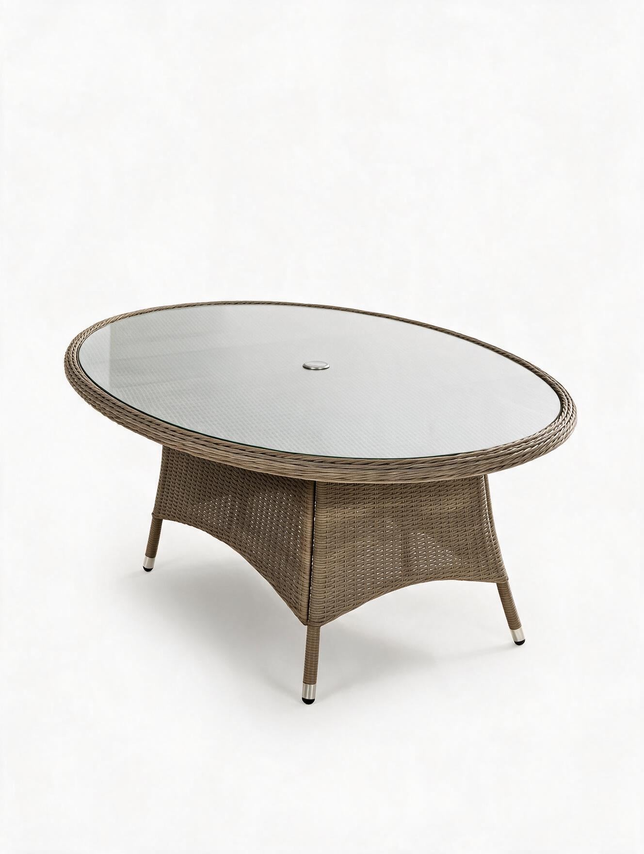 Image of An oval outdoor coffee table with a woven wicker base in a brownish-gray tone and a clear glass top, shown on a white background.