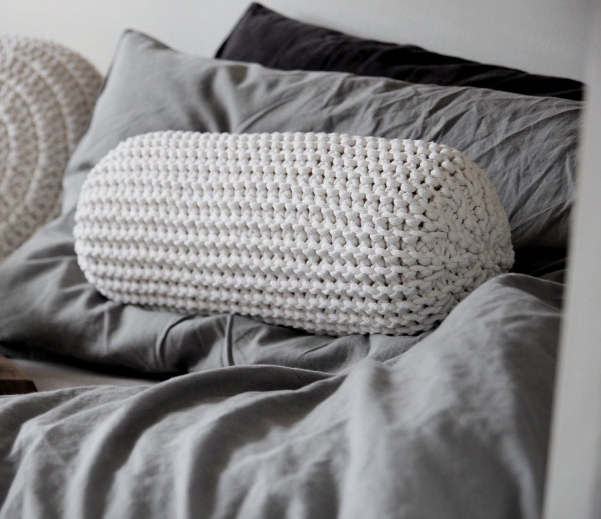 Image of Knitted bolster cushion | IVORY