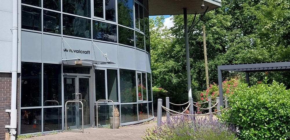Image of Royalcraft showroom exterior with glass windows and garden view