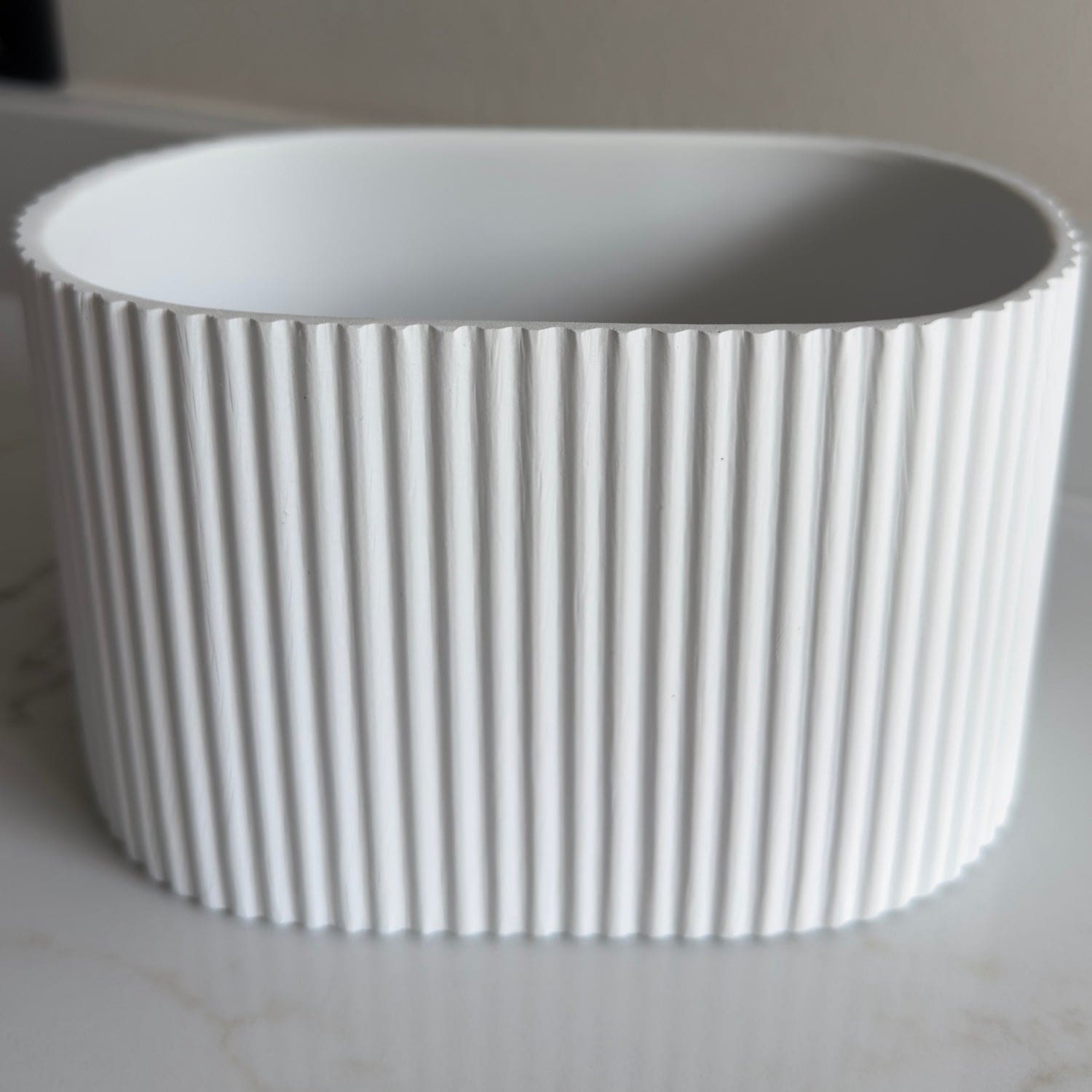 Image of Flutini | White Fluted Oval Stone Resin Indoor Plant Pots (2 Pot Set)