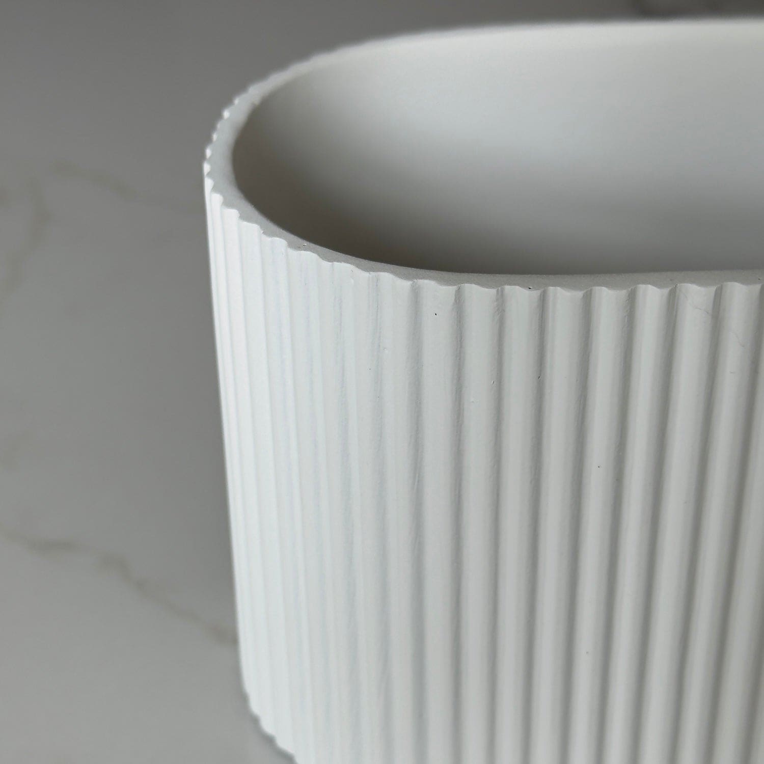 Image of Flutini | White Fluted Oval Stone Resin Indoor Plant Pots (2 Pot Set)