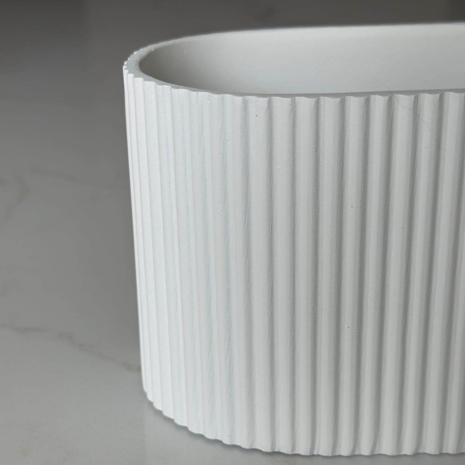 Image of Flutini | White Fluted Oval Stone Resin Indoor Plant Pots (2 Pot Set)